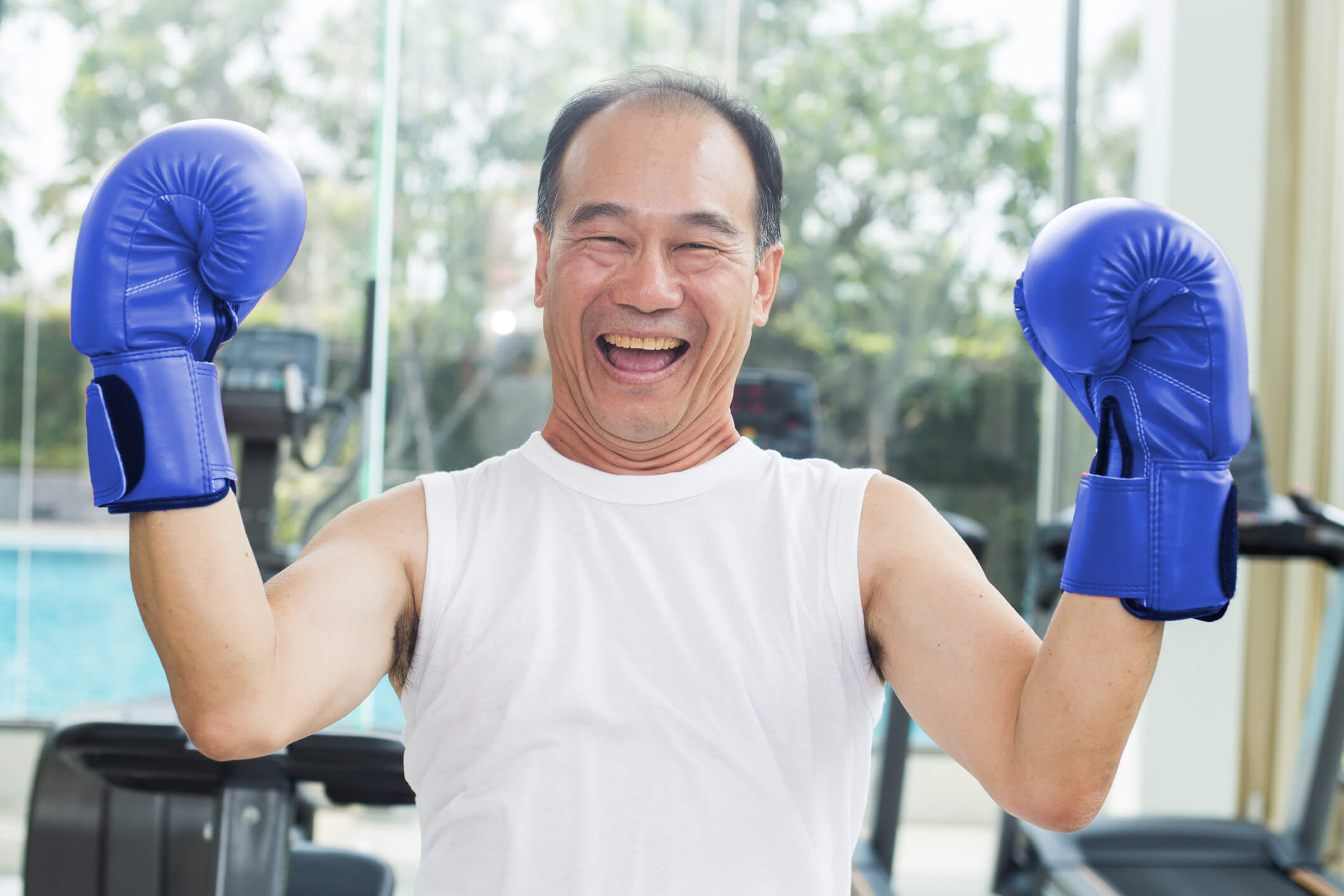 Man with blue boxing gloves on